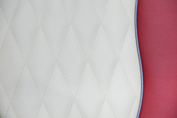 texture of red leather seat close up - Φωτογραφία, εικόνα