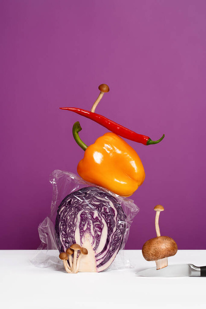 Vegetable art composition - abstract balancing construction of sliced pieces  on duotone background, copy space. Avant garde, modern visual art, fashion, minimal design, healthy food concept. - Foto, Imagem