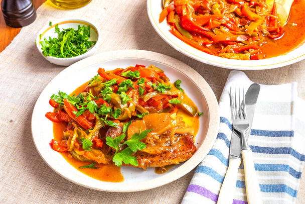 Healthy rustic dinner - pork chop with a side dish of stewed peppers - Photo, Image