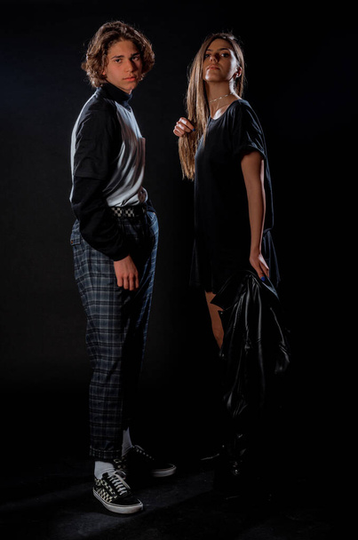 Attractive young man and woman dressed in cool stylish clothing - Zdjęcie, obraz