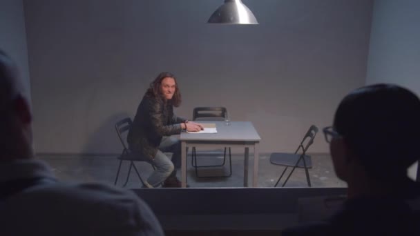 Criminal infuriated in interrogation room - Footage, Video