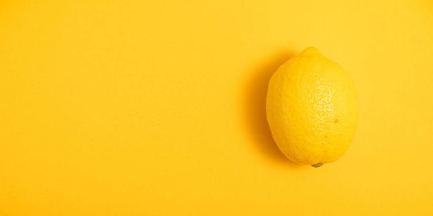 lemon on a yellow background. banner with an empty space under the text - Photo, image