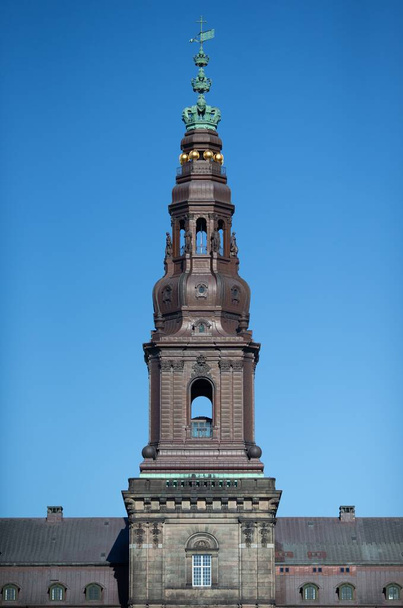 A low angle shot of the Christiansborg Palace tower on a clear sky background - Foto, Bild