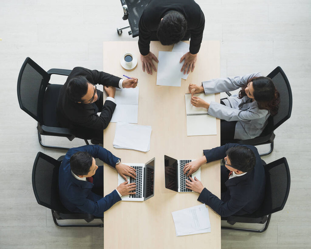 Top view of  asian business people team analyzing statistics financial. High angle view of a team of businesspeople Meeting Conference Discussion Corporate Concept in office. - Foto, Imagen