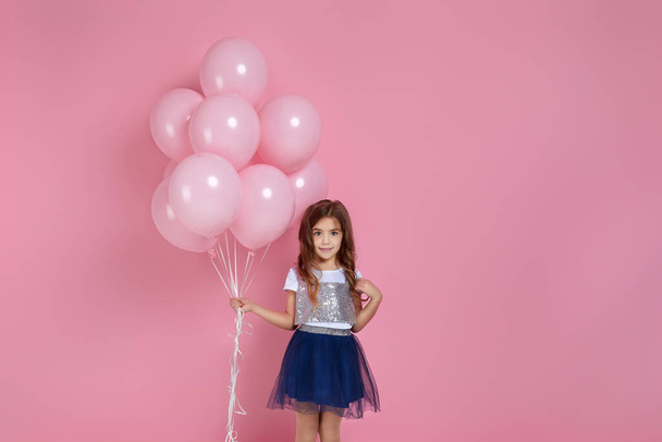 child girl posing with pastel pink air balloons - Fotoğraf, Görsel