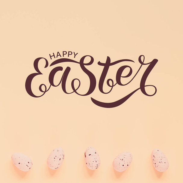 Easter holiday background with easter eggs. Happy easter text. Flat lay. Retro toned - Fotó, kép
