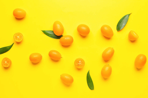 Tasty kumquat fruit on color background - Photo, Image