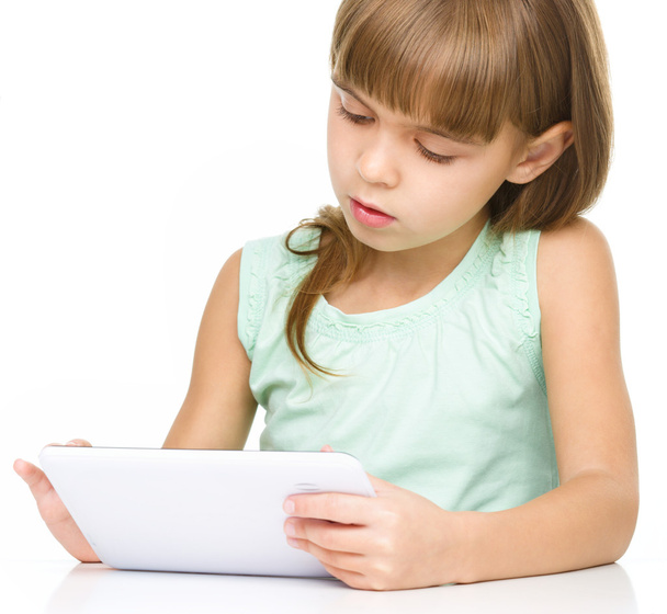 Young girl is using tablet while studying - Foto, Imagem