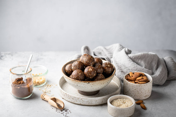 energy balls of oatmeal, nuts and dried fruits on a light gray background. Healthy eating .  - Fotoğraf, Görsel