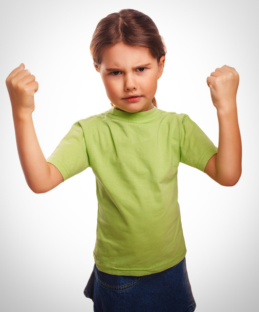 Angry child evil girl shows fists experiencing anger emociones - Foto, Bild