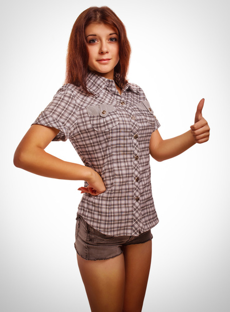 happy woman young girl shows positive sign thumbs yes, shirt sho - Foto, afbeelding
