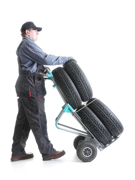 Car tire serviceman - Фото, изображение