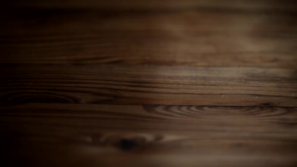 Follow focus on the wooden background. Texture of a wooden background in defocus. - Footage, Video