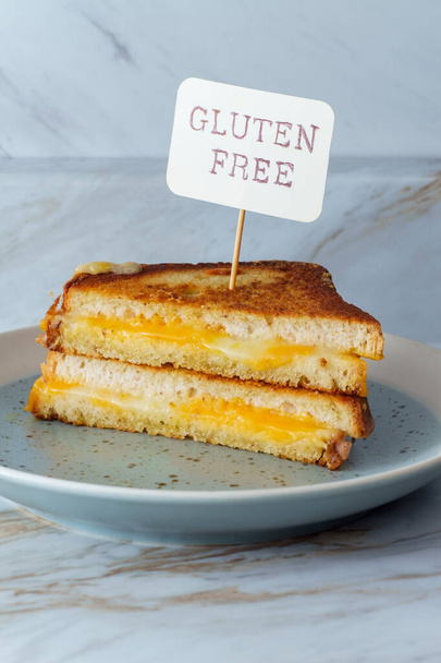 Gluten-free American grilled cheese sandwich on marble kitchen table - Photo, Image