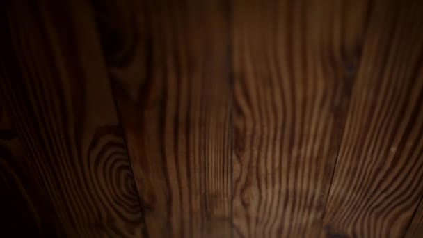 Follow focus on the wooden background. Texture of a wooden background in defocus. - Footage, Video