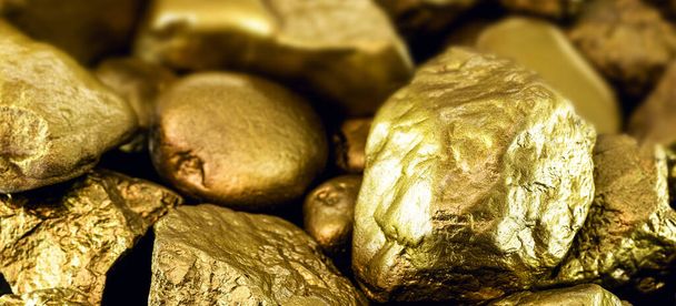 gold stones, rough gold nuggets on black background. - Фото, зображення