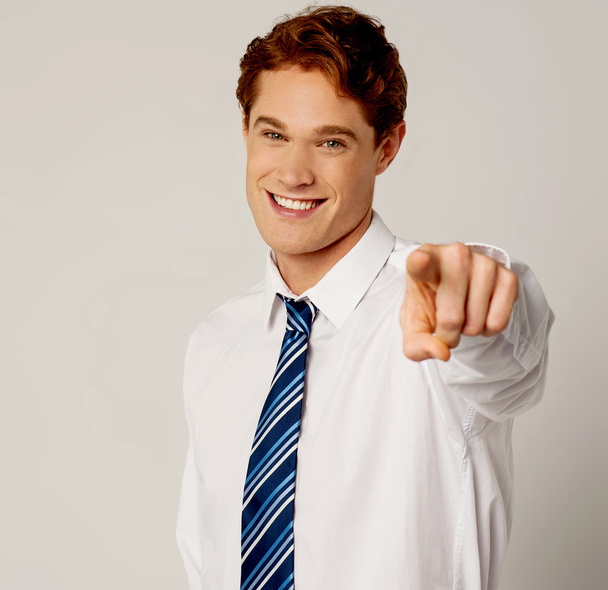 Young smiling businessman pointing you out - Foto, Bild
