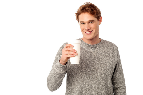 Smiling man holding cold beverage - Photo, Image