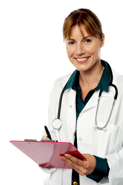 Isolated lady doctor writing prescription - Foto, immagini