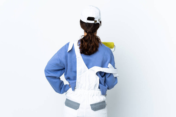 Pintor mujer sobre aislado blanco fondo en la espalda posición
 - Foto, Imagen