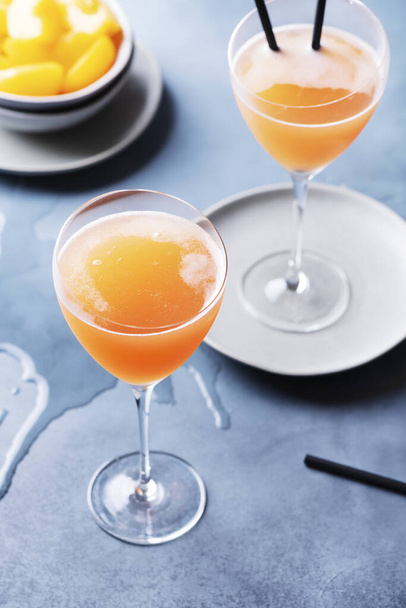 Traditional Italian cocktail bellini with prosecco and peaches, selective focus image - Fotografie, Obrázek