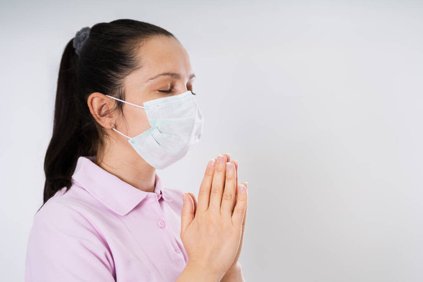 Woman In Gloves And Face Mask Praying During Coronavirus Pandemic - Foto, Imagen
