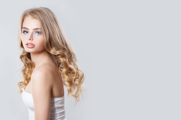 Beautiful blonde posing on white background - Photo, Image