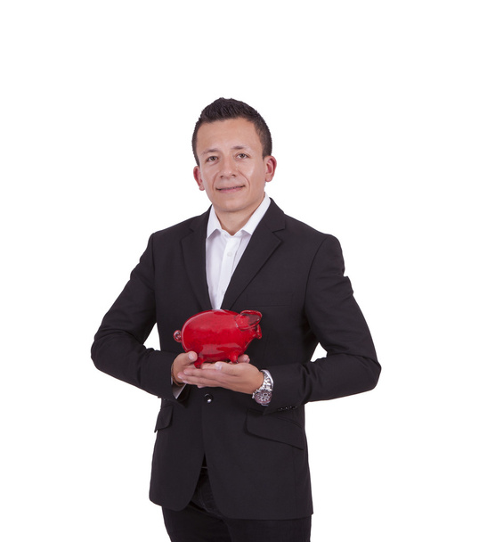lachende jonge zakenman poseren met een piggy bank - Foto, afbeelding
