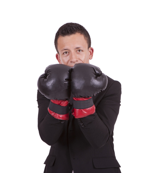 Young businessman wearing boxing gloves - Фото, изображение