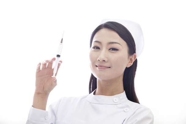enfermeira segurando uma seringa
 - Foto, Imagem
