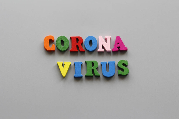 Written by CORONAVIRUS on a gray background. Quarantine all over the world. Coronavirus Prevention Pandemic of the 21st century. Epidemic prevention. - Zdjęcie, obraz