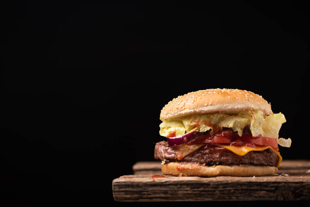 Hamburger on wood background close up - Photo, Image