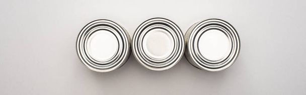 flat lay with silver cans on white background, food donation concept - Photo, Image