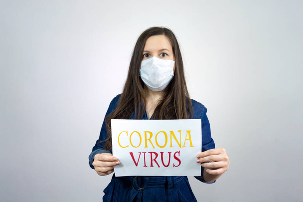Woman holding sign Stay Home Save Lives global message coronavirus. Quarantine to fight COVID-19 pandemic. - Фото, изображение