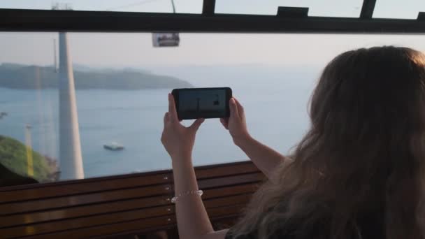 She wants to take video of her cable car ride - Footage, Video