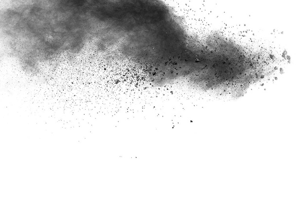 Черные частицы брызги на белом фоне. Взрыв черной пороховой пыли. - Фото, изображение
