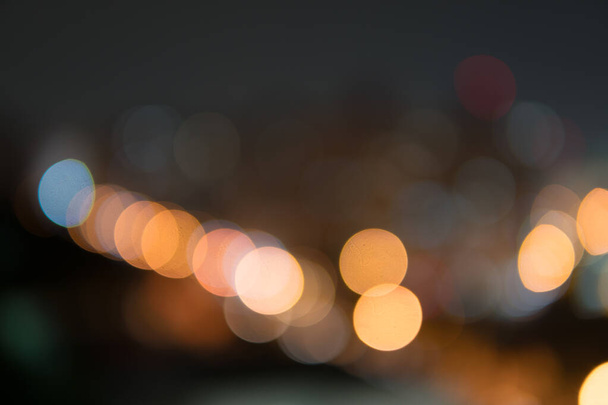 Abstract bokeh night garden in city background.Defocused city night filtered bokeh abstract background. - Photo, image