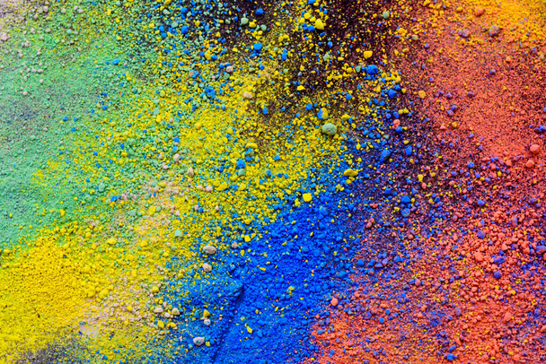 A splatter of pastel natural colored pigment powder on black background. - Φωτογραφία, εικόνα