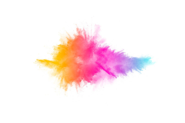 Kleurrijke poeder explosie op witte achtergrond. Pastel kleurstof deeltjes spatten. - Foto, afbeelding
