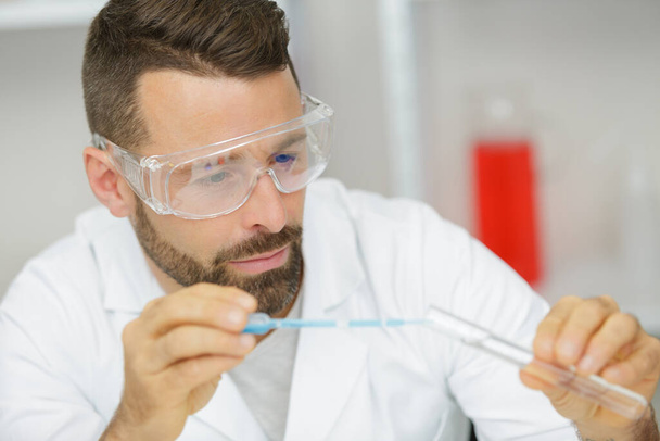 male worker in lab glasses - Fotó, kép