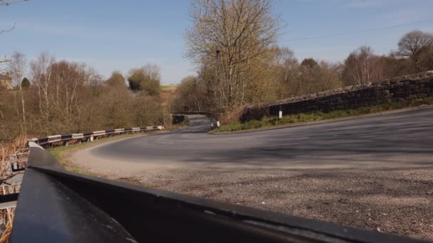 Man Mountain Biking along an empty countryside road - Footage, Video