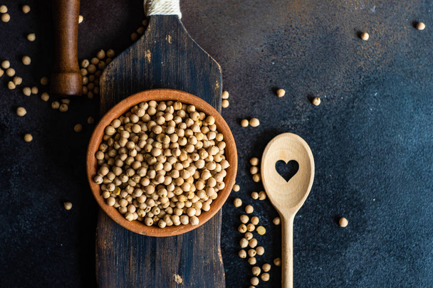 Raw chickpeas in a bowl as a organic food concept - Photo, Image