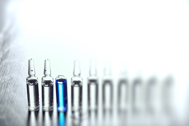 ampoules medicine vaccine concept, abstract background, vaccination virus protection - Фото, изображение