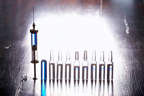 ampoules medicine vaccine concept, abstract background, vaccination virus protection - Fotó, kép