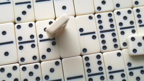 white dominoes with black dots on a dark background - Footage, Video