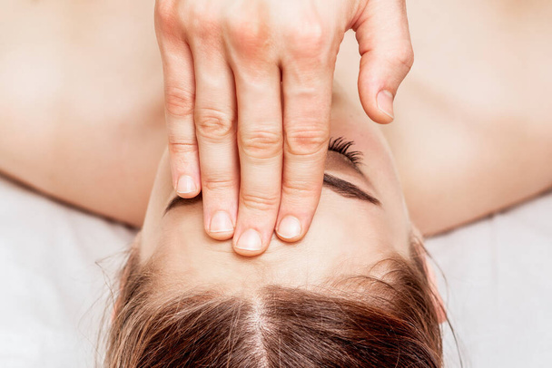 Forehead massage of young woman, close up. - Φωτογραφία, εικόνα