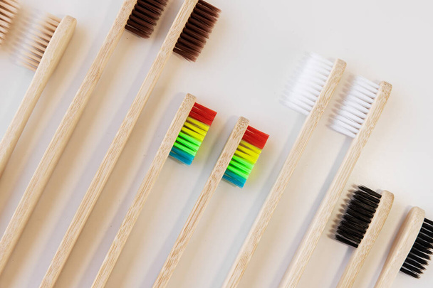 Group of eco bamboo toothbrushes, on white background. Different color. Top view, copy space. Natural organic product for oral hygiene. Dental zero waste and no plastic concept. Safe for the earth.  - Photo, Image