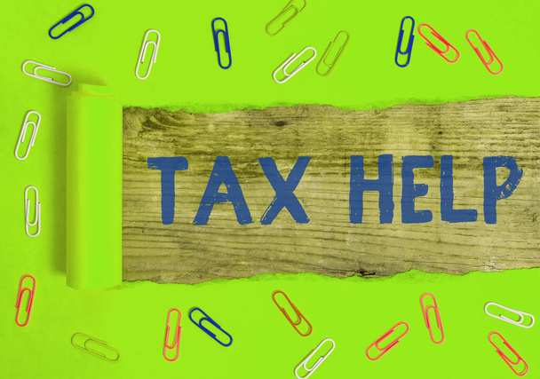Sana kirjoittaa tekstiä Tax Help. Liiketoiminta-ajatus pakollisesta maksuosuudesta valtion tuloihin
. - Valokuva, kuva