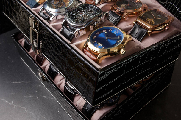 storage black leather box with collection of men wrist watches - Foto, afbeelding