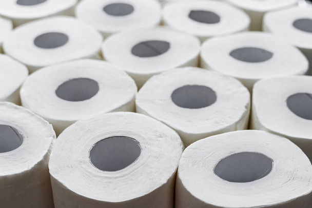 Toilet paper roll background. Concept of lack of toilet paper in stores due to coronavirus, Covid-19, hygiene, panic - 写真・画像